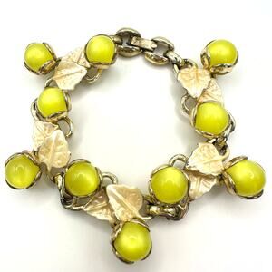 Vintage 1940s gold tone yellow moonglow lucite cream enamel leaves bracelet